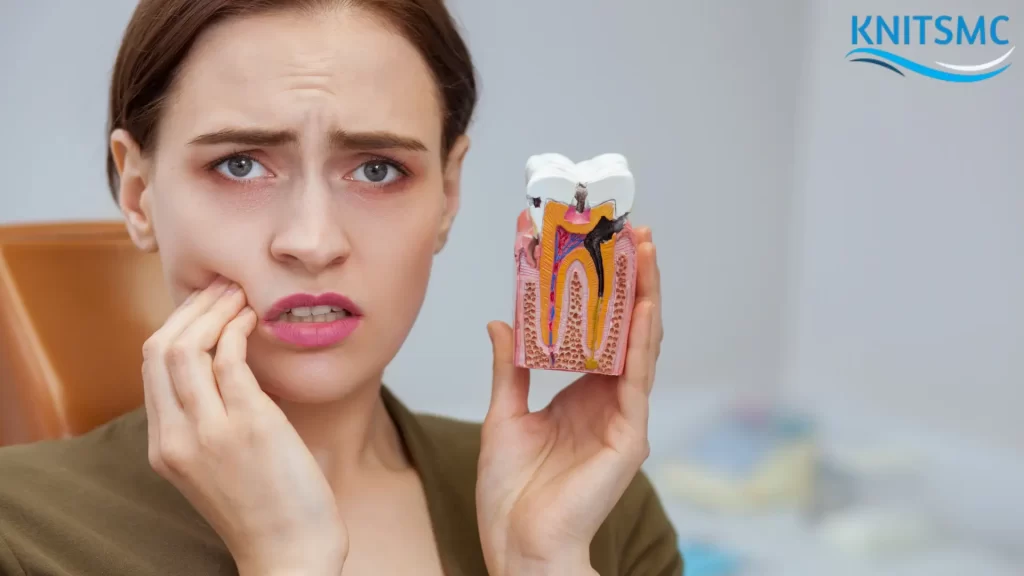 A concerned woman holding her cheek in pain, showing a dental model with cavities, highlighting the question: "Can You Reverse Cavities?