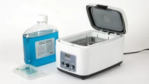 Ultrasonic cleaner and cleaning solution ready for use on small mechanical components for precise cleaning.